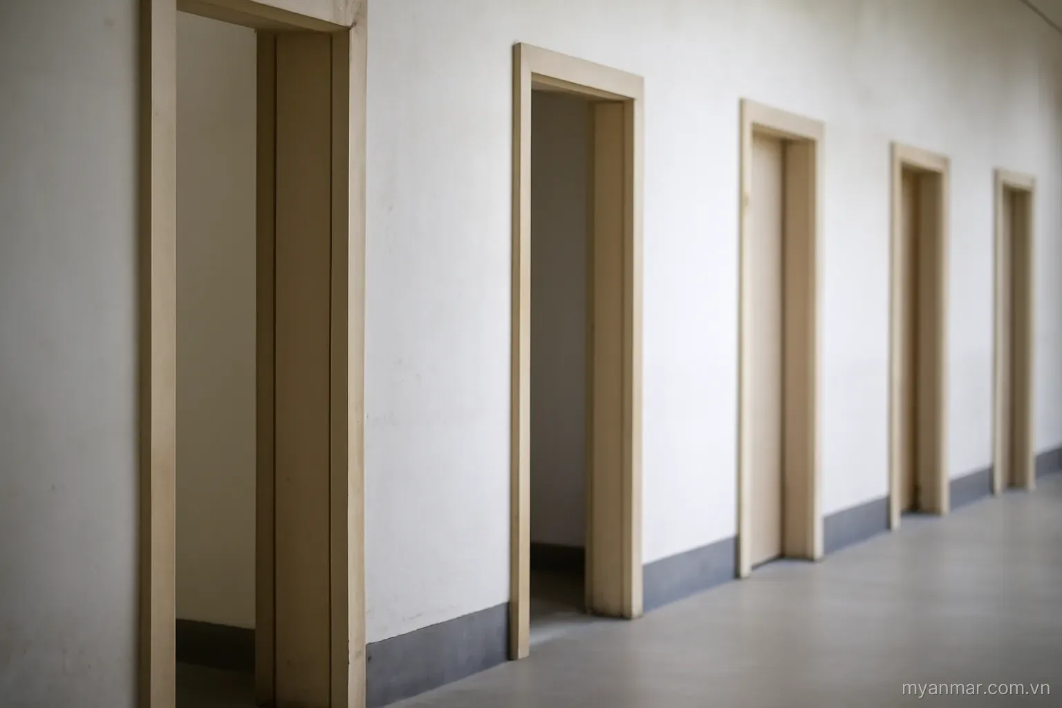 One doorway frame removed from a row leaving a wider gap than the others, side view, no text