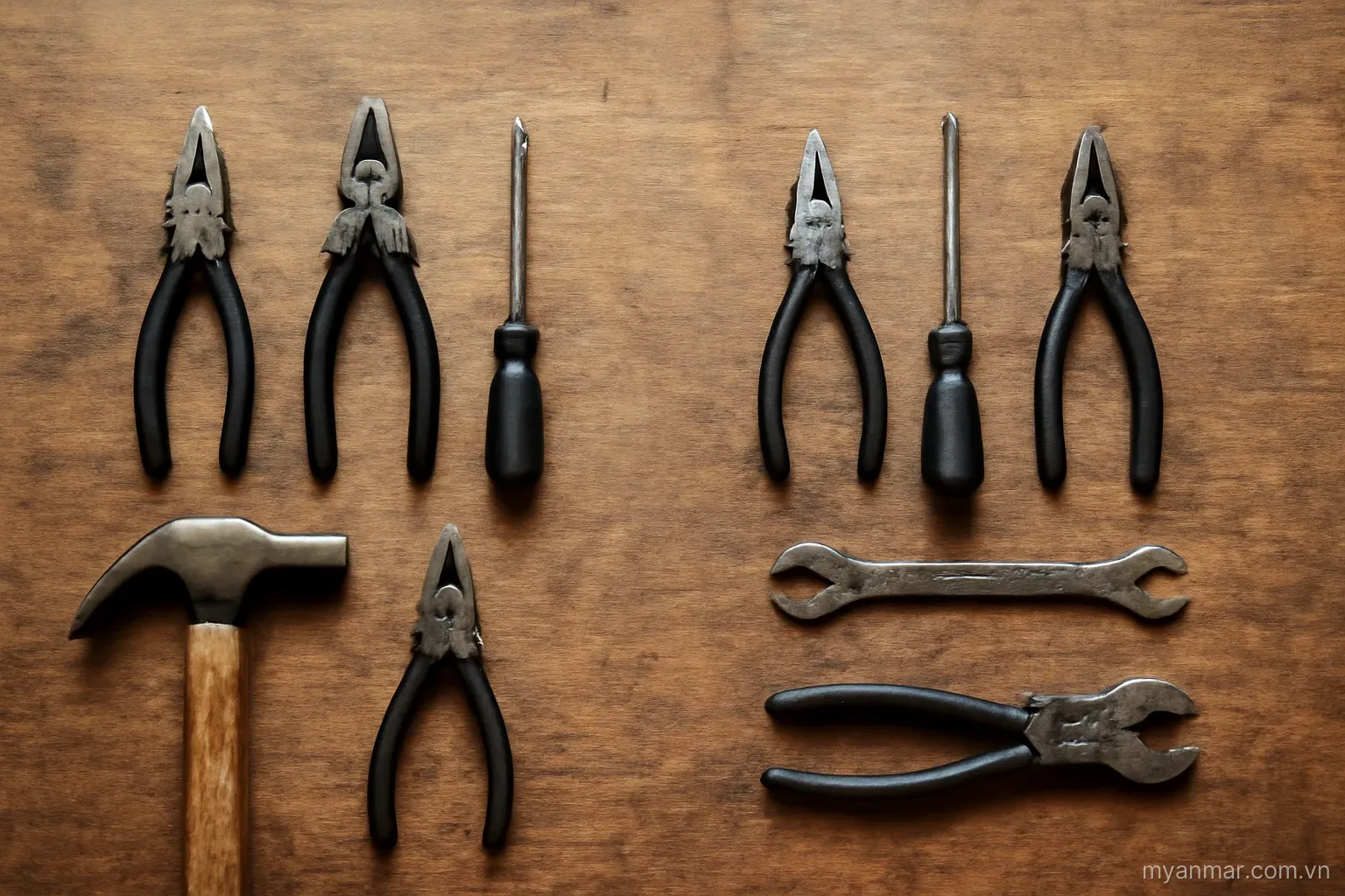 Two sets of identical hand tools laid out side by side on a workbench, overhead view, no text
